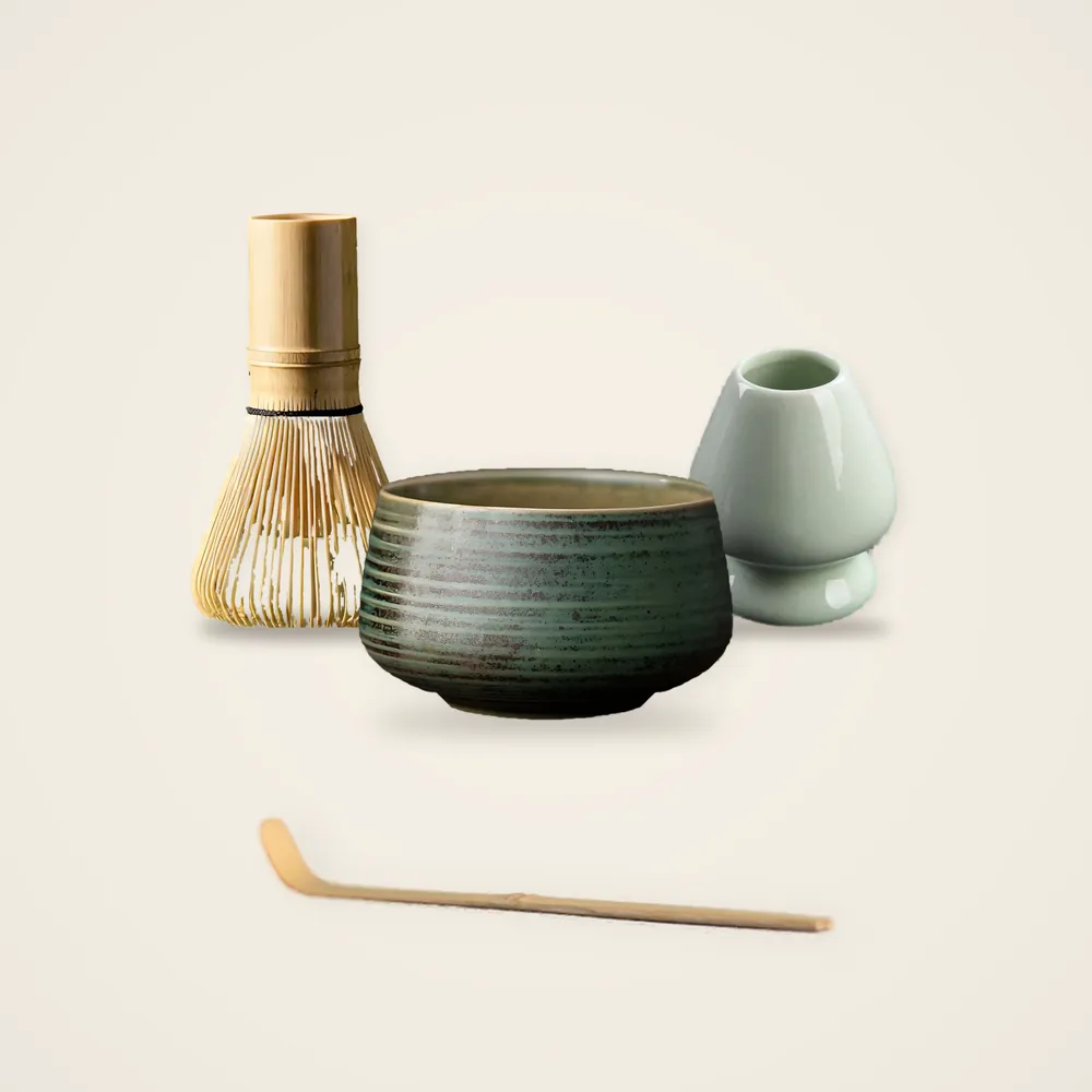 The set + bowl: the bamboo whisk, the scoop, the celadon holder and the moss-green ceramic matcha bowl